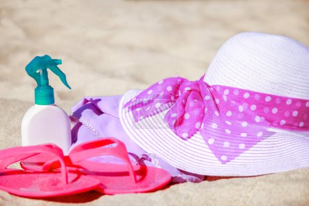 Photo for Beautiful stylish hat with slippers by the sea in the summer on the nature - Royalty Free Image