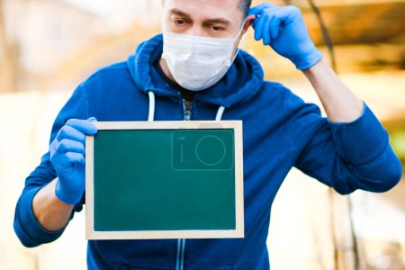 Photo for Coronavirus Outbreak of the corona virus. Epidemic Viral Respiratory Syndrome. Plate in Man's Hands - Royalty Free Image