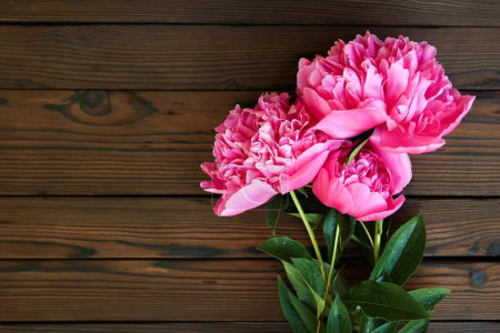 Photo for Peonies flowers on wooden background concept holidays - Royalty Free Image