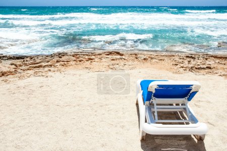 Photo for Beautiful chaise lounge by the sea on nature background - Royalty Free Image