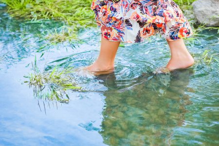 Photo for Feet of happy girl on nature weekend in park travel - Royalty Free Image