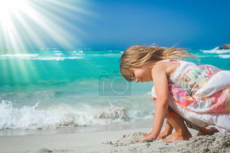 Photo for Happy child playing by the sea outdoors - Royalty Free Image