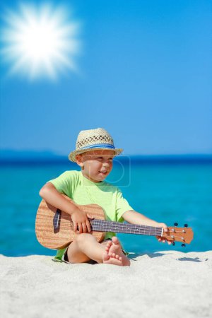 Photo for Happy child with ukulele at iorya in nature weekend travel - Royalty Free Image