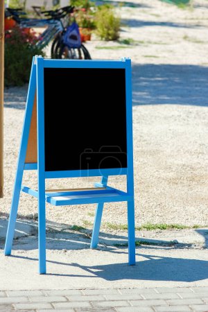 Photo for Easel board outdoors menu for coffee weekend travel - Royalty Free Image