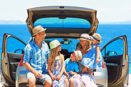 Photo for Happy family in a car near the sea of Greece concept of happiness - Royalty Free Image