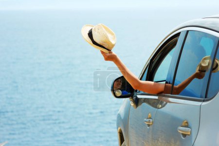 Photo for Happy girl from car at sea greece background - Royalty Free Image