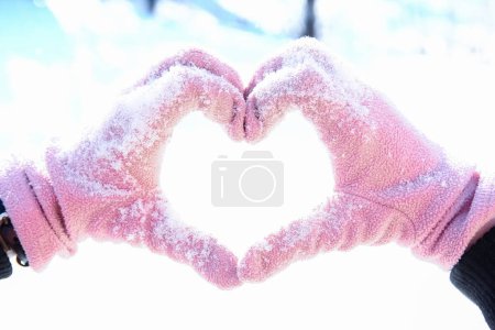 Photo for Heart in the hands of a girl against the sky Valentine's day in a park in nature - Royalty Free Image