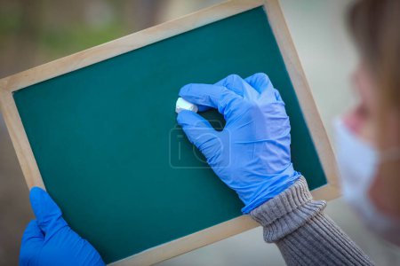 Photo for Coronavirus Outbreak of the corona virus. Epidemic Viral Respiratory Syndrome. Girl's Plate in Hands. China - Royalty Free Image