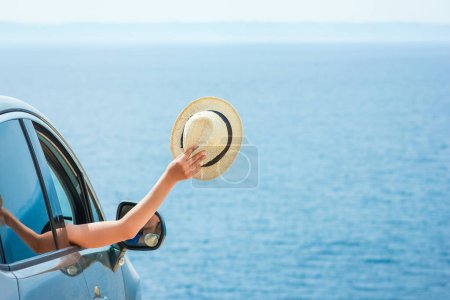 Photo for Happy girl from car at sea greece background - Royalty Free Image