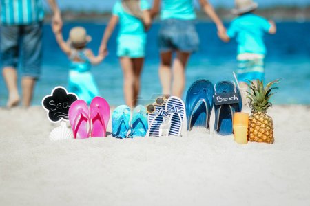 Photo for Happy family near the sea in nature with slippers travel trip vacation - Royalty Free Image