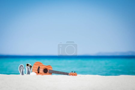 Photo for Beautiful guitar on the sand by the Greek sea - Royalty Free Image