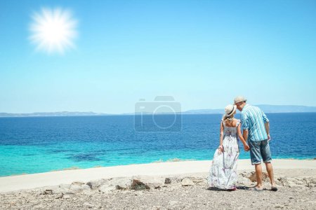 Photo for Happy couple near the seashore in nature weekend travel - Royalty Free Image