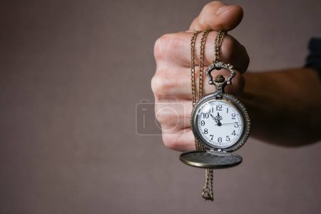 Photo for Pocket watch in the hands of a man - Royalty Free Image