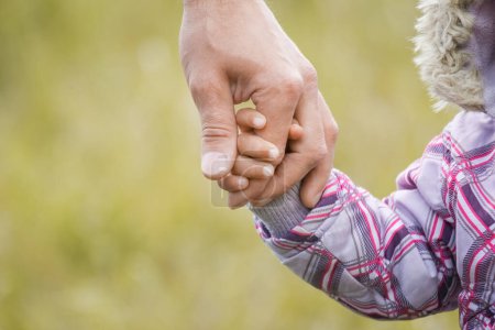 Photo for Hands Happy parents and child outdoors in the park - Royalty Free Image