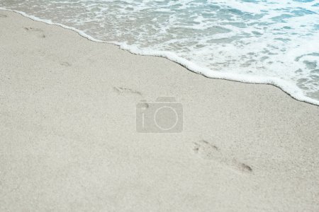 Photo for A Beautiful sea and sand on the shore vacation travel background - Royalty Free Image