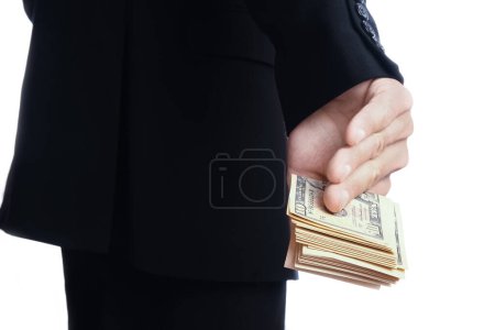 Foto de Hombre de negocios sosteniendo dinero sobre fondo blanco - Imagen libre de derechos