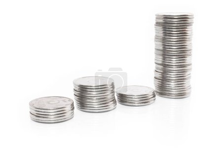 Foto de Dinero de negocios gráfico monedas sobre fondo blanco - Imagen libre de derechos