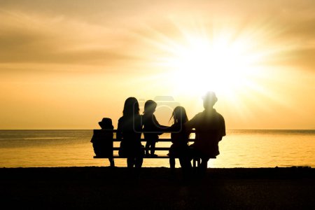 Photo for Happy family in nature by the sea on a trip silhouette - Royalty Free Image