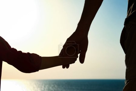 Photo for Beautiful arms of the parent and child silhouette of the background - Royalty Free Image