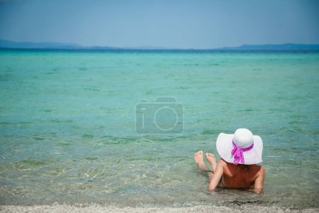 Photo for Happy girl at sea in greece on sand nature - Royalty Free Image