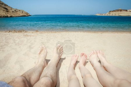 Photo for Stylish beautiful legs on the sea shore background - Royalty Free Image