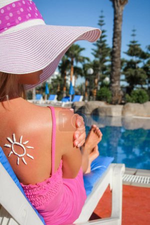 Photo for Happy girl with the sun on her back at the pool in the nature - Royalty Free Image