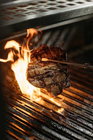 Photo for Beef T-bone steak grilled on open fire - Royalty Free Image