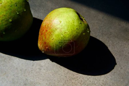Photo for An appetite, juicy, colorful pear. An organic pear in close-up. - Royalty Free Image
