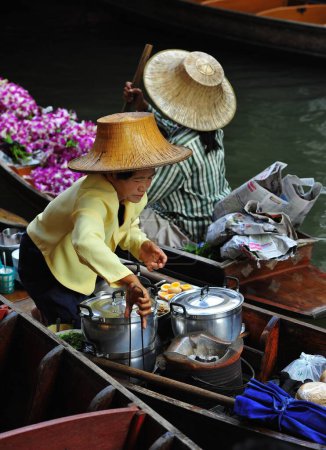 Photo for A beautiful view of the colorful women working at Damnoen Saduak Floating Market. Thailand 5, 2012. - Royalty Free Image