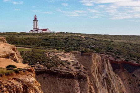 Photo for Landscape of Cape Espichel Lighthouse on cliff in Sesimbra, Portugal - Royalty Free Image