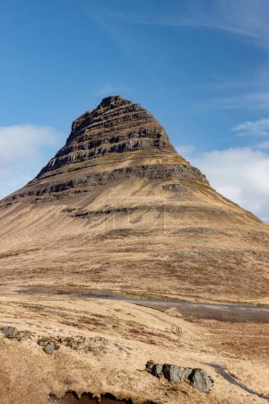 landscape of yellow Kirkjufell (Church Mountain) in Iceland at autumn