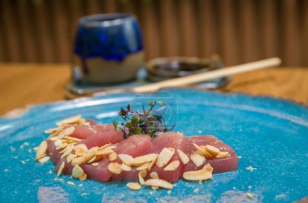 Photo for Delicious premium tuna sashimi arranged on an elegant handmade platter. - Royalty Free Image