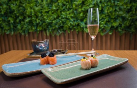 Photo for Combined of differents japanese sushi on a elegant blue plate. - Royalty Free Image