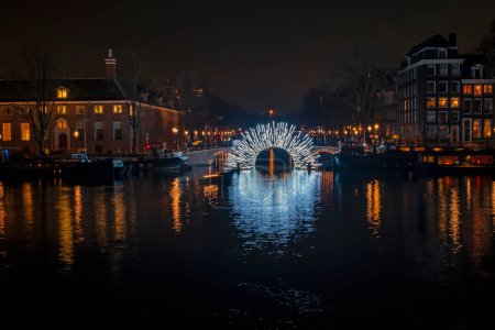 Foto de City scenic from Amsterdam at the Amstel in the Netherlands by night - Imagen libre de derechos