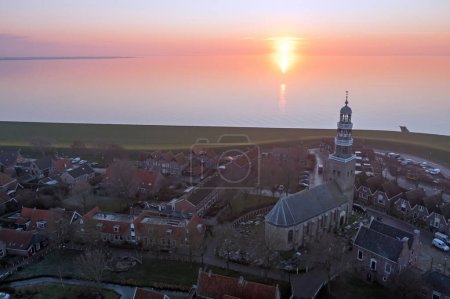 Foto de Aerial from the historical village Hindeloopen at the IJsselmeer in Friesland the Netherlands at sunset - Imagen libre de derechos