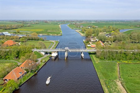 Photo for Aerial from the Altskou bridge in the countryside from Friesland in the Netherlands - Royalty Free Image