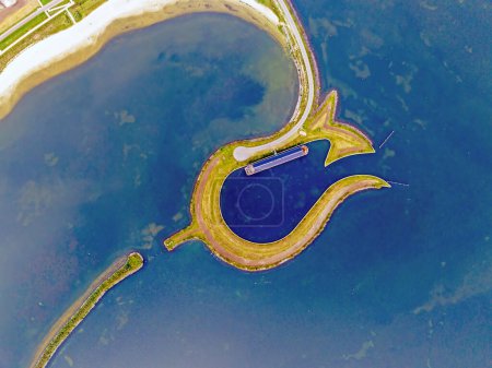 Photo for Aerial view of Tulpeiland in Wolderwijd at the coast of Zeewolde,  in the Netherlands. It is an artificial peninsula in the shape of a tulip. - Royalty Free Image