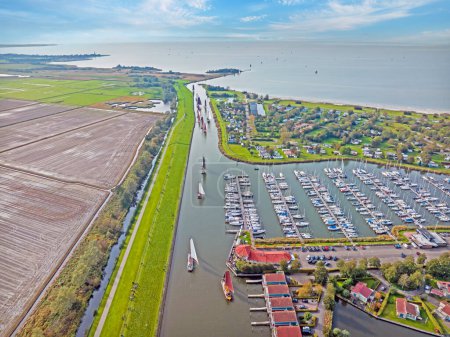 Photo for Aerial from traditional fishing boats at the Workumer Strontrace in Workum in the Netherlands - Royalty Free Image