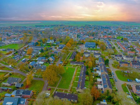 Photo for Aerial from the village Koudum in Friesland the Netherlands at sunset - Royalty Free Image