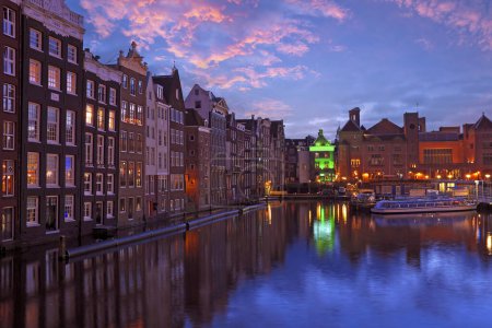 Photo for City scenic from Amsterdam by night in the Netherlands at sunset - Royalty Free Image