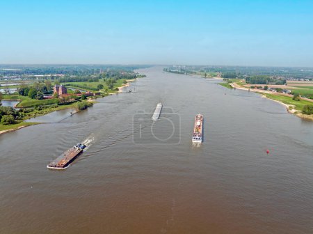 Aerial from shipping on the river Merwede with castle Loevestein in the Netherlands 