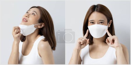 Photo for Suffocating young woman taking a breath out of face mask and still wearing face mask, concept image of long covid and post pandemic world, with or without mask - Royalty Free Image