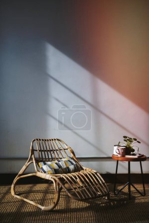 Photo for Wicker seat by a window - Royalty Free Image