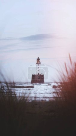 Photo for Rattray Head lighthouse at Aberdeenshire coast, Scotland - Royalty Free Image