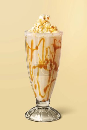 Photo for Caramel popcorn vanilla milkshake on background - Royalty Free Image