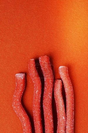 Photo for Red chewy candies coated with sugar - Royalty Free Image