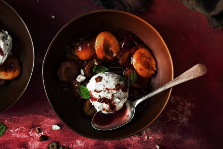 Photo for Ice cream roasted plums bowl - Royalty Free Image