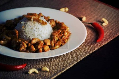 Photo for Chicken, rice, cashews, chilli peppers, food, lunch, dinner, plate - Royalty Free Image