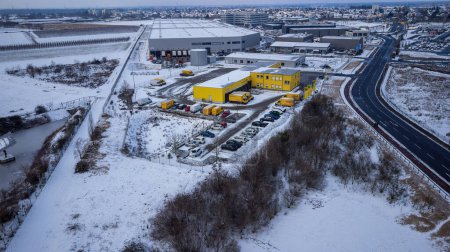 Photo for View over the DHL delivery station Weiterstadt with Metro, Segmller in winter with snow - Royalty Free Image