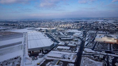 Photo for View over the DHL delivery station Weiterstadt with Metro, Segmller in winter with snow - Royalty Free Image